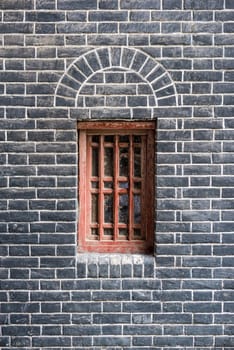 Small red window in a brick wall, Chengdu, China