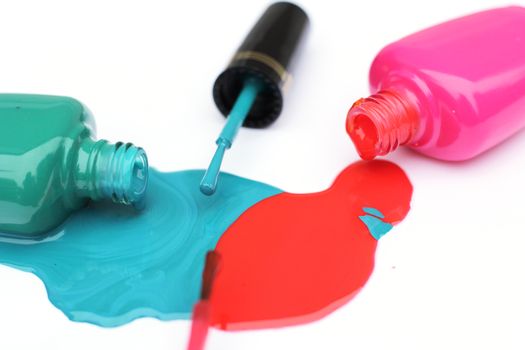 Spilled Nail Polish on White Background Pink and Green