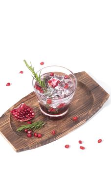 Pomegranate juice with ripe pomegranate on white background. summer drink.