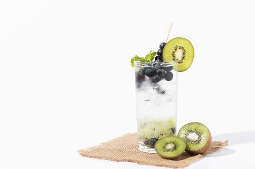 Kiwi cocktails beverage with ripe blueberry on white background. summer drink.