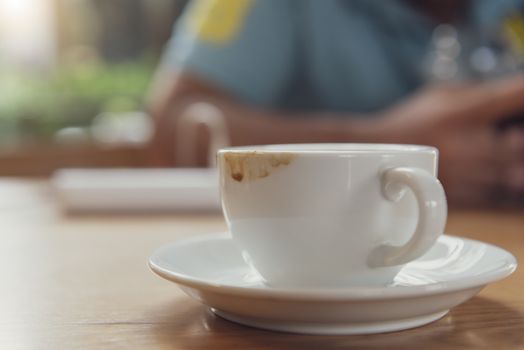 Espresso coffee cup  on wood table in cafe.