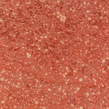 Red rough stone texture background. Material construction and architectural detail.