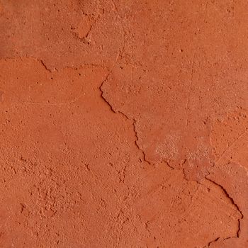 Red rough stone texture background. Material construction and architectural detail.