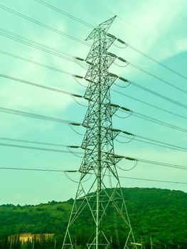 electric high power stand on green hill in rainny season