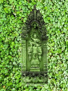 green sandstone angel and green clover background