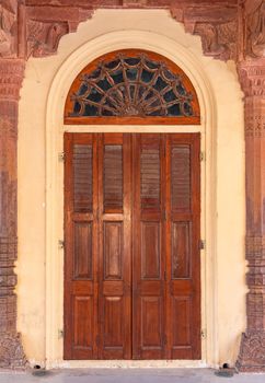 Antique rustic ancient wooden door. Architectural element.