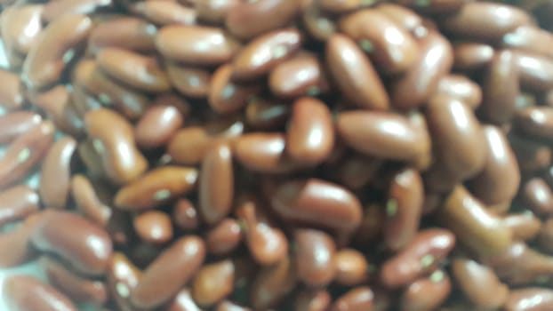 Kidenry beans:   Closeup view of uncooked red kidney beans. Dark red useful beans background.