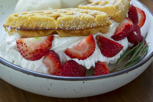 Close-up of strawberry waffles on dish look so testy.