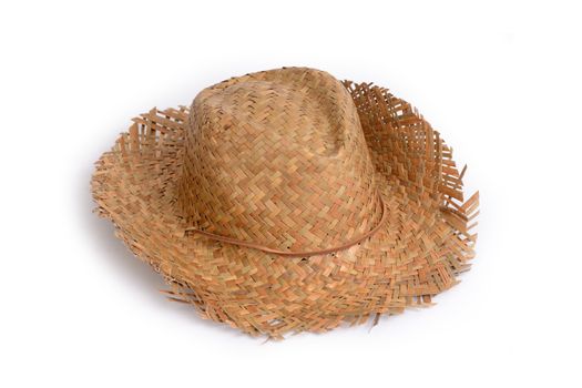 Straw hat for sun protection on the beach in summer.