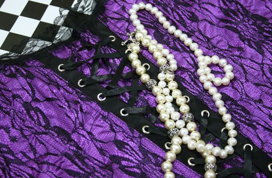 Lingerie and Pearls Background Purple and Black Lace