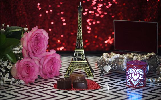 Pink Rose With Eiffel Tower Replica Shallow DOF, Focus on Chocolate Candy