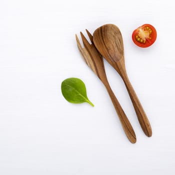 Food background and salad concept with raw ingredients  flat lay on white wooden background.