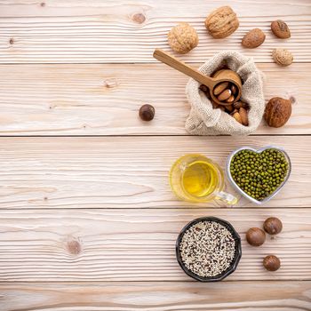 Ingredients for the healthy foods selection .Various different kinds of nuts set up on wooden table.