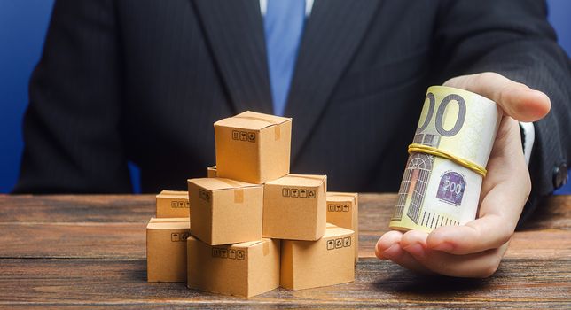 A businessman makes an offer of payment in euros for boxes goods. Superprofits. Investments financing in production, taxes, income revenues. Trade and exchange goods, offers for cooperation. Profit