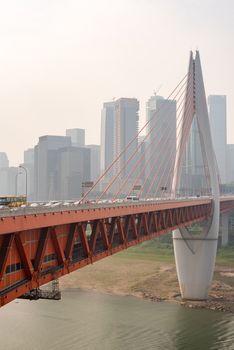 QianSiMen bridge with skyscrapers in the haze, China