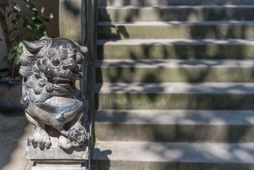 Lion statue and stairs in BaoLunSi temple Chongqing, China