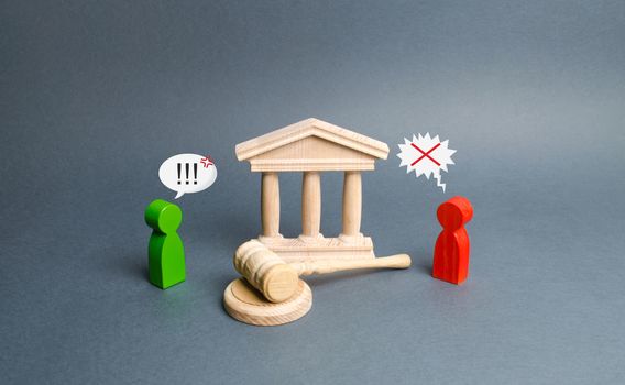 Two figures of people opponents stand near the courthouse and the judge's gavel. Conflict resolution in court, claimant and respondent. Court case. the defendant defends the position of innocence.