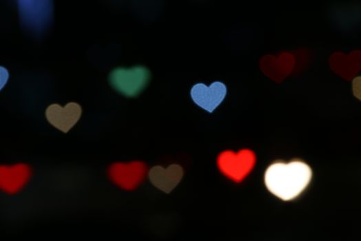 Valentines Colorful heart-shaped on black background lighting bokeh for decoration at night backdrop wallpaper blurred valentine, Love Pictures background, Lighting heart shaped soft at night abstract