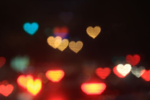 Valentines Colorful heart-shaped on black background lighting bokeh for decoration at night backdrop wallpaper blurred valentine, Love Pictures background, Lighting heart shaped soft at night abstract