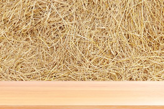 wood plank on straw, empty wood table floors on straw hay dry background, wood table board empty front straw wall backdrop, wooden plank blank over straw yellow brown color