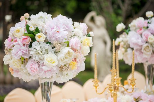 Wedding decoration with flowers on a table outdoors