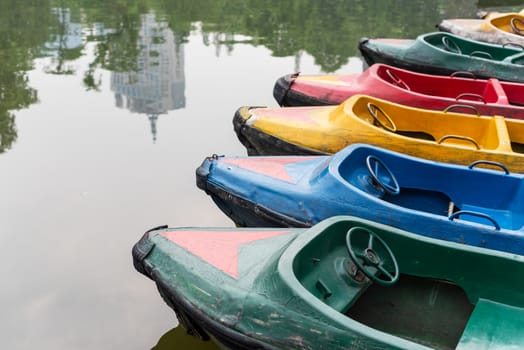 old multicolored boats on a lake, Chengdu, China