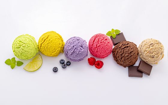 Various of ice cream flavor ball blueberry ,lime ,pistachio ,almond ,orange ,chocolate and vanilla isolate on white background . Summer and Sweet menu concept.