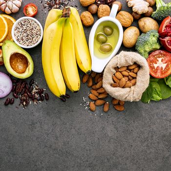 Ingredients for the healthy foods selection on dark background. Balanced healthy ingredients of unsaturated fats and fiber for the heart and blood vessels.