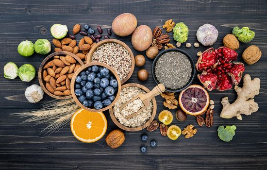 Ingredients for the healthy foods selection. The concept of healthy food set up on wooden background.