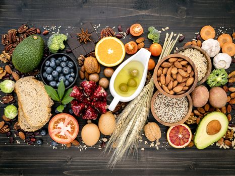 Ingredients for the healthy foods selection. The concept of healthy food set up on wooden background.