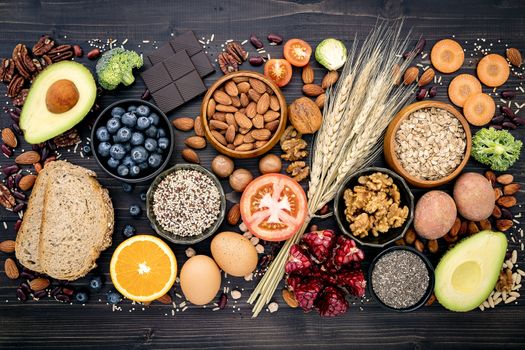 Ingredients for the healthy foods selection. The concept of healthy food set up on wooden background.