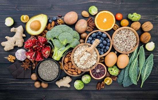 Ingredients for the healthy foods selection. The concept of healthy food set up on wooden background.