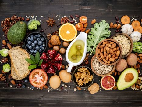 Ingredients for the healthy foods selection. The concept of healthy food set up on wooden background.