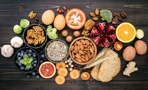 Ingredients for the healthy foods selection. The concept of healthy food set up on wooden background.