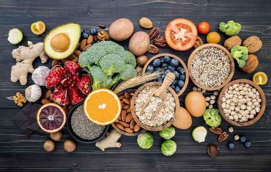 Ingredients for the healthy foods selection. The concept of healthy food set up on wooden background.