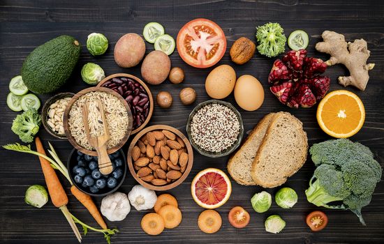 Ingredients for the healthy foods selection. The concept of healthy food set up on wooden background.