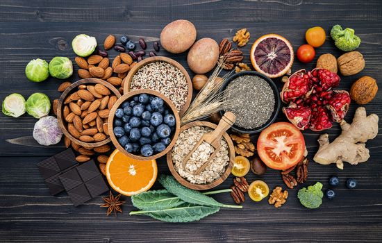 Ingredients for the healthy foods selection. The concept of healthy food set up on wooden background.