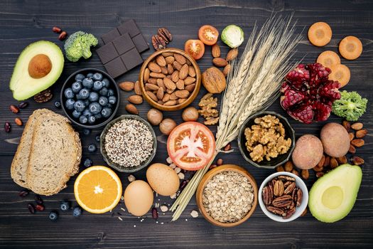 Ingredients for the healthy foods selection. The concept of healthy food set up on wooden background.