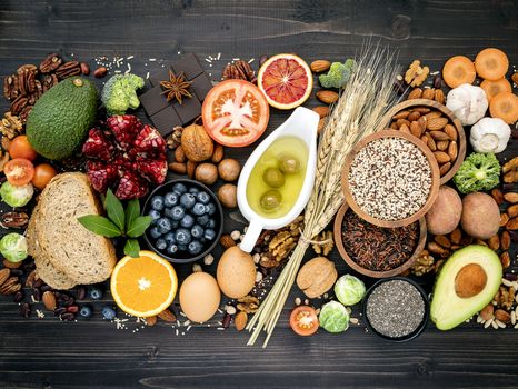 Ingredients for the healthy foods selection. The concept of healthy food set up on wooden background.