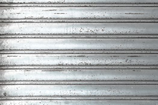 Grungy light metal window roller blinds background