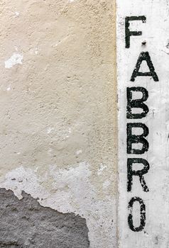 Exterior of a blacksmith's shop ("fabbro" translation from Italian).