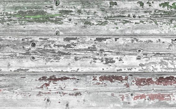 Flag of Italy painted on old grungy wooden background. Faded texture.