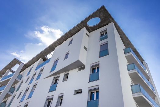 White living house with apartments with sky background