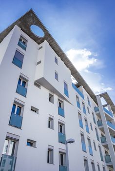 White living house with apartments with sky background