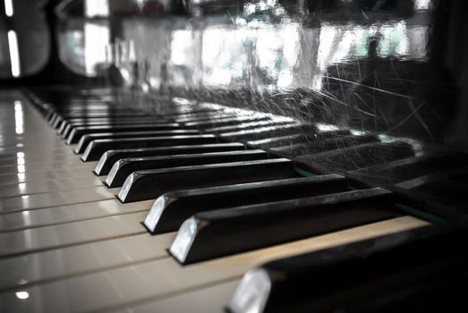 Extreme closeup of a classic vintage piano keyboard. Shallow depth of field. Defocused blurry background.