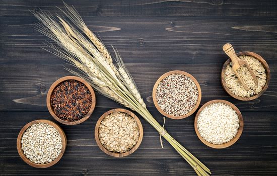 Various natural organic cereal and whole grains seed in wooden bowl for healthy food ingredient product concept.