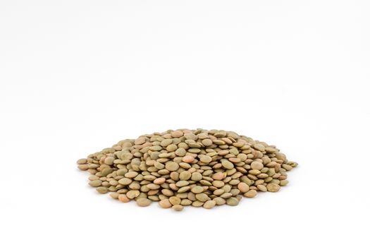 Organic lentils Isolated on a white background. Close up shot.