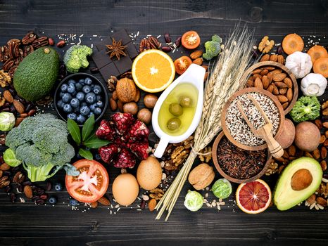 Ingredients for the healthy foods selection. The concept of healthy food set up on wooden background.