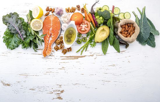 Ketogenic low carbs diet concept. Ingredients for healthy foods selection on white wooden background. Balanced healthy ingredients of unsaturated fats for the heart and blood vessels.