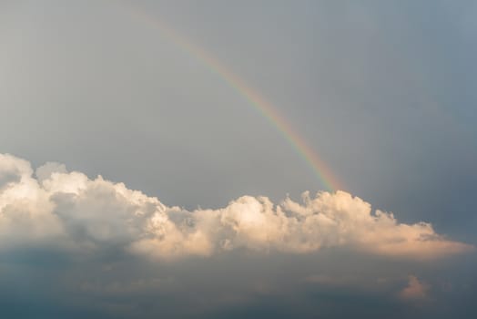 Rainbow in a dark cloudy sky, China